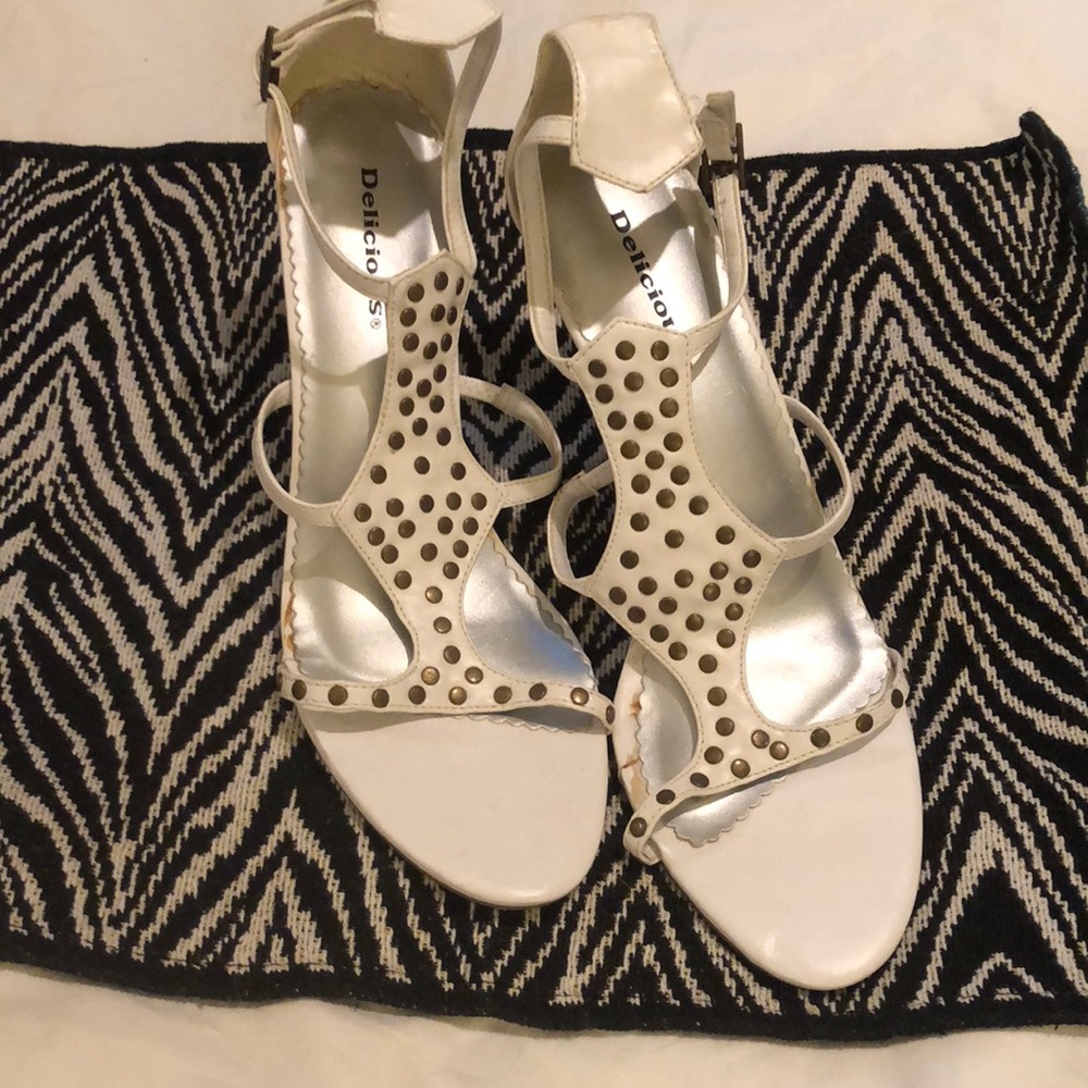 White sandal heels with gold brad decoration